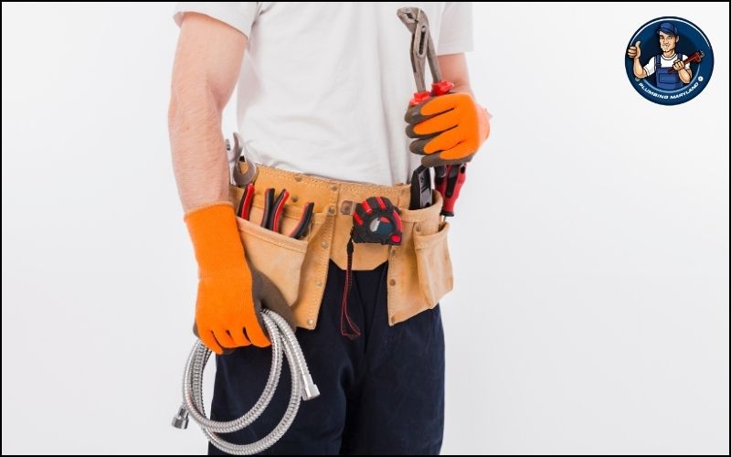 plumber with plumbing tools